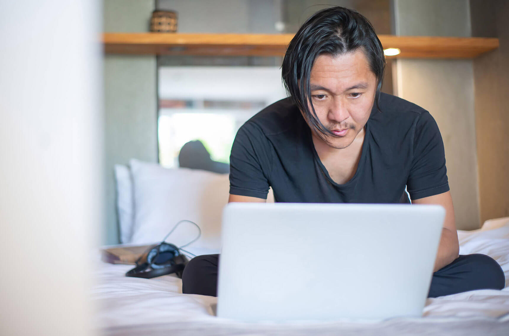 Man planning his budget on a laptop